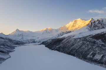 Wall Mural - aerial view of snow mountain sunrise landscape