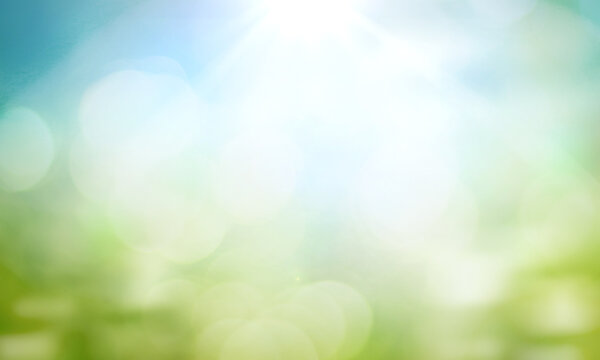 World environment day concept: green grass and blue sky abstract background with bokeh