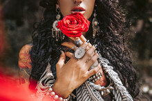 Beautiful Young Gypsy Style Woman With Red Rose Outdoors