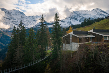 Wall Mural - Clouds over Swiss Alps peaks in Mürren village on an autumn evening