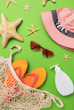 Various Beach Accessories On A Green Background, Summer Background, Top View
