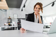 © bnenin - Enjoying at work, having smile on her face.