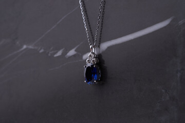 Wall Mural - Sapphire pendant with platinum necklace.