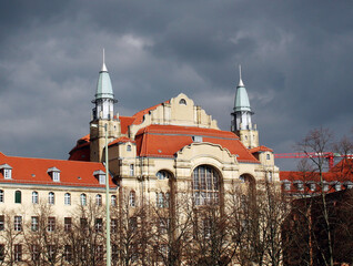 Wall Mural - An old building with a red roof and two spiers in the center of Berlin. The architecture of the old city.