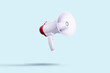 © Alex - white megaphone flies on a light background. Advertising and messages concept