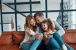 © gstockstudio - Happy young family with girl preschool age smiling while bonding together