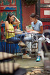 © luckybusiness - Two female friends having a good time while reading books in the bar. Leisure, bar, outdoor, friendship