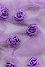 Fake Purple Roses On Chiffon Fabric In Purple Or Lilac Color For Backgrounds.