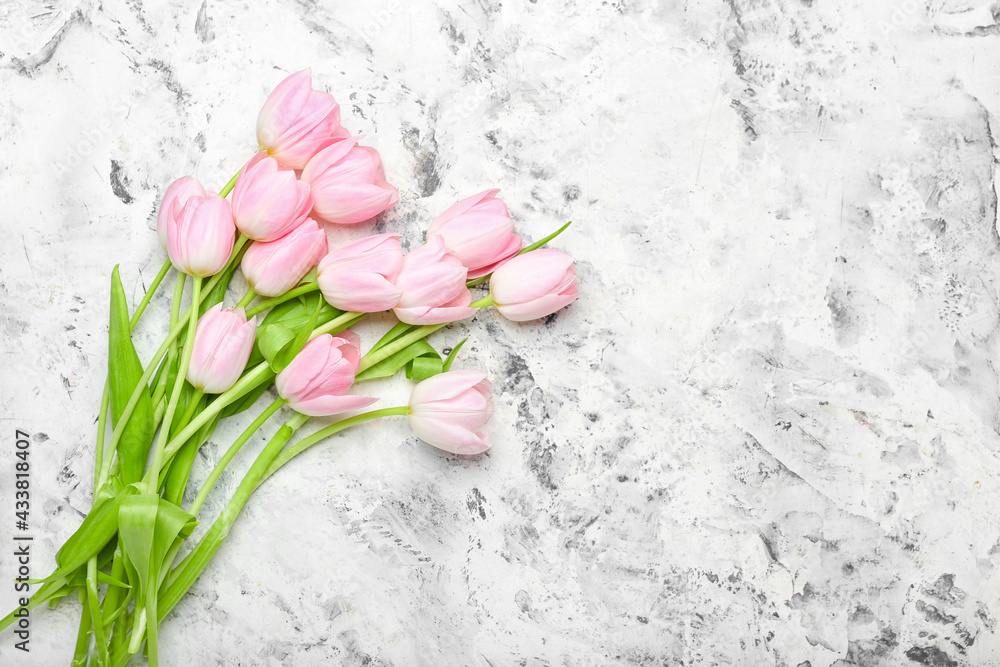 Beautiful tulip flowers on grunge background