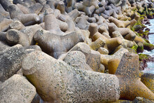 Tetrapods. Huge Concrete Structures With Four Legs, Used As Wave Breakers On The Seashore. 