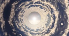 A Surreal Perspective-bending Scene, Flying Through A Cloud Tunnel, Made From Time Lapse Footage Of Clouds.