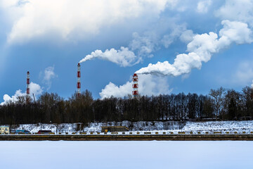 Wall Mural - Factory chimneys with thick smoke coming out of them. smoking pipes of harmful chemical production.