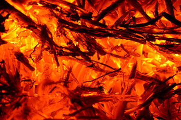 The graphic resource consists of burning and smoldering branches and wood.