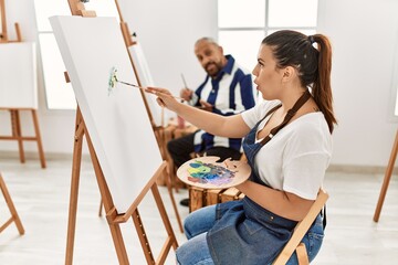 Poster - Young artist woman at art studio scared and amazed with open mouth for surprise, disbelief face