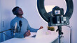 © CameraCraft - Man wearing headphones recording a video podcast using a laptop and microphone. Motivational speaker. Concept of online consulting or Podcast. High quality photo