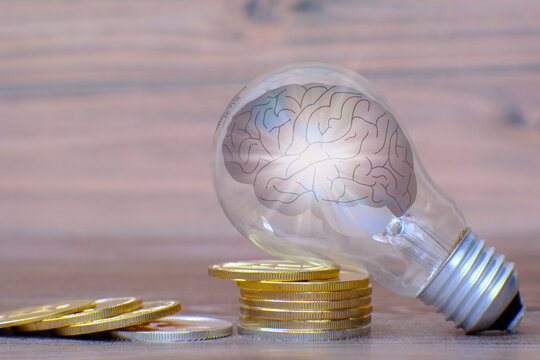 Light bulb with brain inside and concept of the business idea, businessman thinking about business ideas, business innovation concept, brainstorming new business ideas