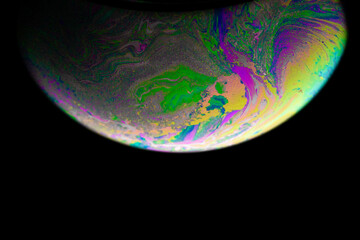 Wall Mural - Cosmos planets. Abstract galaxy background with globe planet earth in universe space with sunlight on dark background. Macro soap bubble made with dish soap.