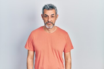 Sticker - Handsome middle age man with grey hair wearing casual t shirt depressed and worry for distress, crying angry and afraid. sad expression.