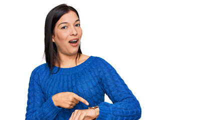 Sticker - Young hispanic woman wearing casual clothes in hurry pointing to watch time, impatience, upset and angry for deadline delay