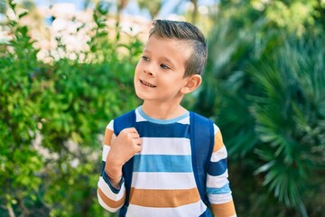 Poster - dorable caucasian student boy smiling happy standing at the park.