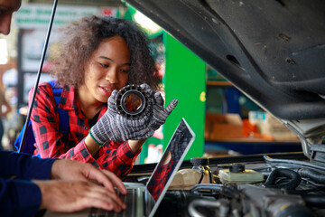 Wall Mural - A Russian Male mechanic  with tablet pc computer making system diagnostic in car at workshop. car service, repair, technology, maintenance and people concept