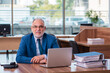 © Elnur - Old male employee working in the office