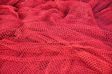 Fisher Net Close Up. Colourfoul Fisher Net Close-up And Details. Red Fishing Nets Textured Background