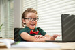 © Volodymyr - Child schoolboy pupil learn english online at home school. Homeschooling and distance education for kids.