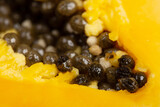 Fototapeta Mapy - Ripe papaya close-up on yellow background. Fresh fruits and vegetables healthy food