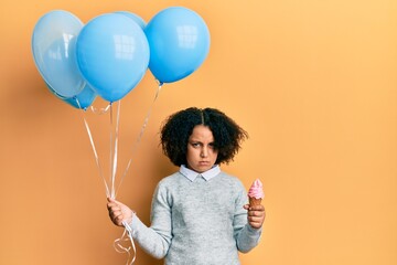 Sticker - Young little girl with afro hair holding ice cream and blue balloons skeptic and nervous, frowning upset because of problem. negative person.