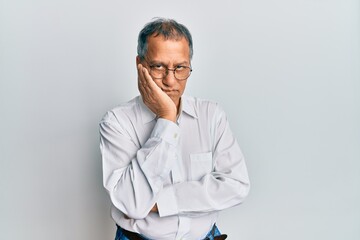 Poster - Middle age indian man wearing casual clothes and glasses thinking looking tired and bored with depression problems with crossed arms.