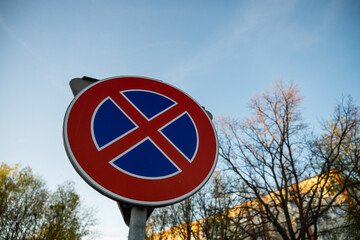 Street signs under blue skies