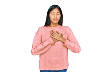 Sticker - Beautiful young asian woman wearing casual winter sweater smiling with hands on chest with closed eyes and grateful gesture on face. health concept.