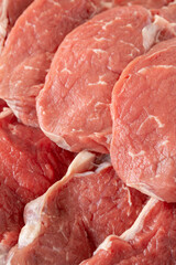 raw steak on white wooden background. Boneless beef entrecote. Meat background. Close-up beef anricot meat