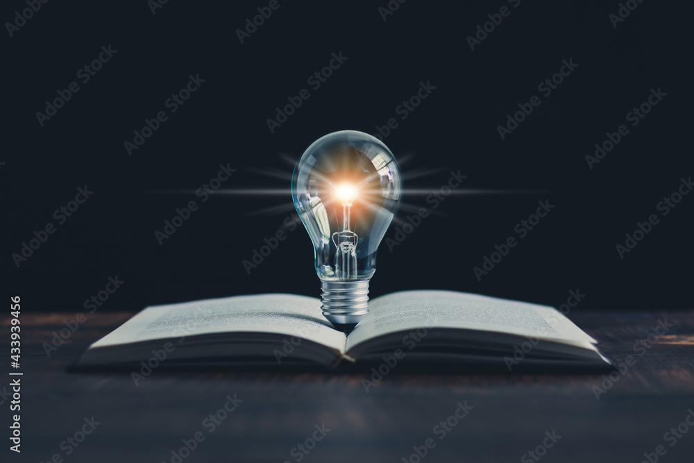 Glowing light bulb and book or text book with futuristic icon. Self ...