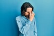 © Krakenimages.com - Young hispanic man wearing casual clothes tired rubbing nose and eyes feeling fatigue and headache. stress and frustration concept.
