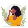 Young black african american woman with black curly hair uses an asthma inhaler against an allergic attack. Concept of world asthma day. Allergy, asthmatic. Bronchial asthma. Vector flat illustration