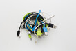 © waraphong - messy wire usb connector and earphone on white background