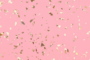 Wall Mural - golden confetti on pastel pink background, party gold glitter backdrop.