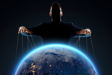 a man, a puppeteer, manipulates the planet. the concept of world conspiracy, world government, manip