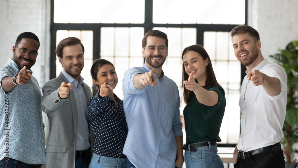 We need you. Happy confident professional group pointing finger at camera. Diverse millennial team of employees making choice, offering job, searching candidates for hiring. Head shot photo portrait - obrazy, fototapety, plakaty 
