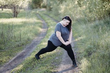 Wall Mural - Overweight woman warming up muscles before workout