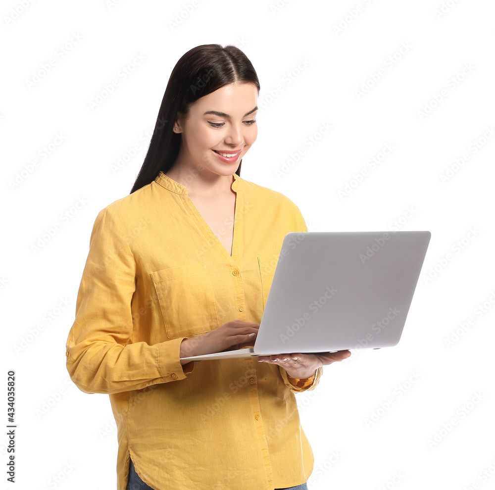 Beautiful young woman with laptop on white background