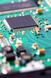 Macro shot of computer circuit board with microchip and other components