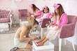 Children in spa center having a manicure.