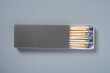 © Freer - grey color matchbox and grey match sticks on a grey background