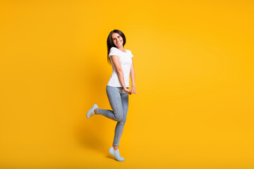 Sticker - Full body photo of charming nice young woman adorable pose isolated on shine yellow color background