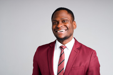 Portrait of happy african american businessman smiling broadly and looking at camera