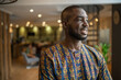 © JonoErasmus - Portrait smiling black african businessman wearing traditional clothing