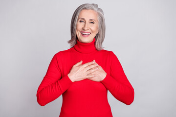 Poster - Photo of cheerful aged woman happy positive smile hands on chest grateful appreciate isolated over grey color background